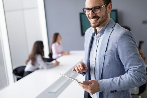 Business colleagues in modern conference meeting room during presentation